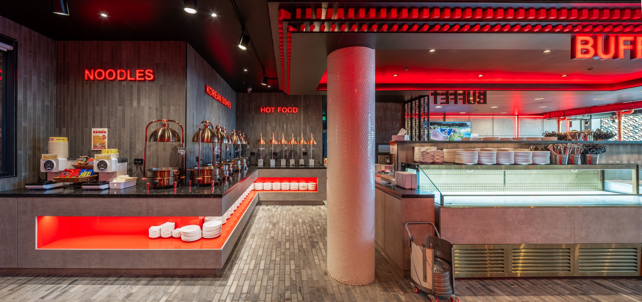 Noodle and hot food counters with red illuminated plinths